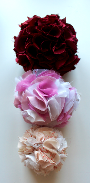 lined up size comapsion party pom poms