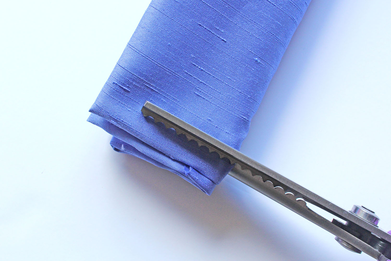 Cutting Purple Fabric Pinking Shears