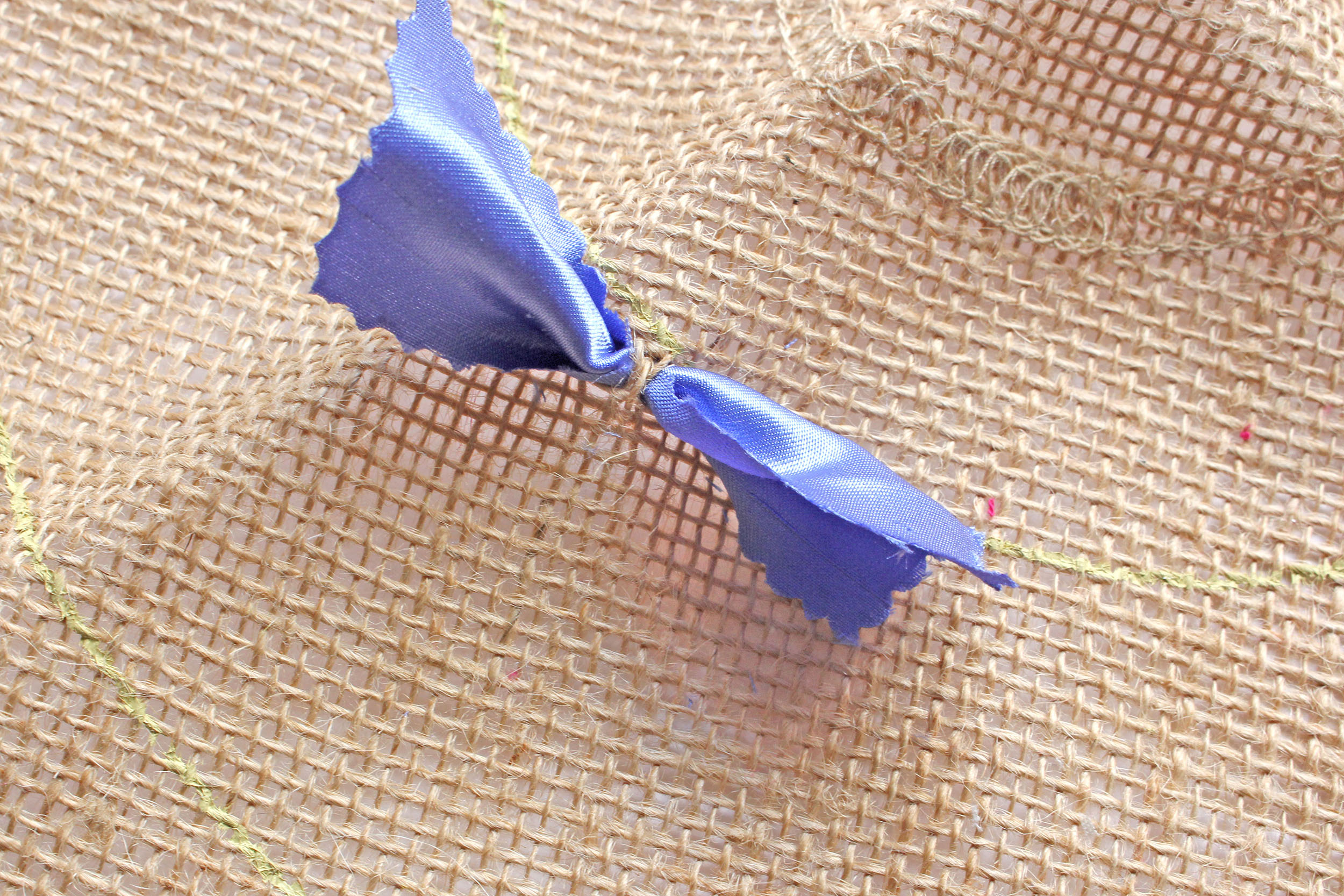 Pulling Fabric Strip Through Hessian