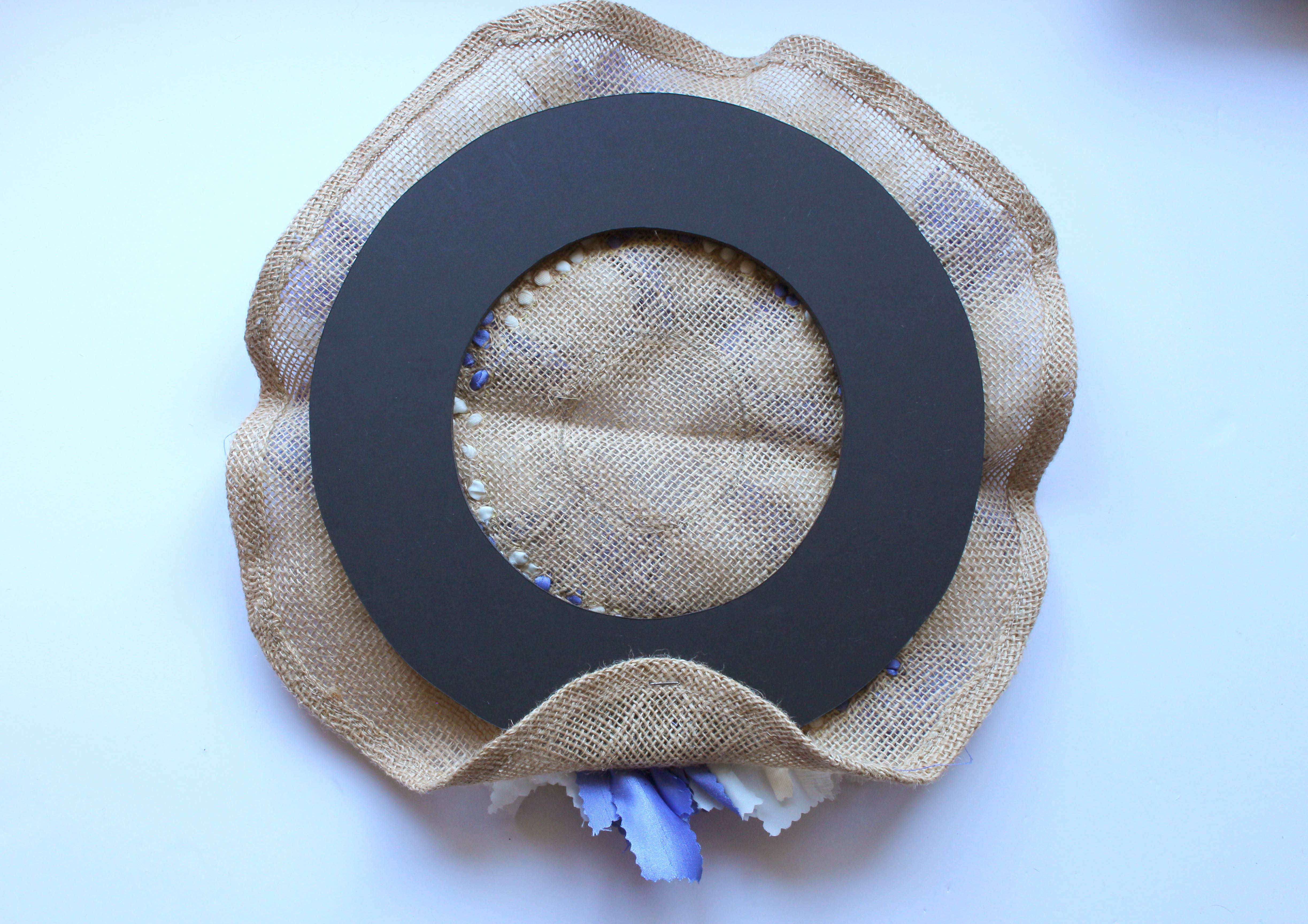 Beginning Stapling Wreath Hessian to Foam Board