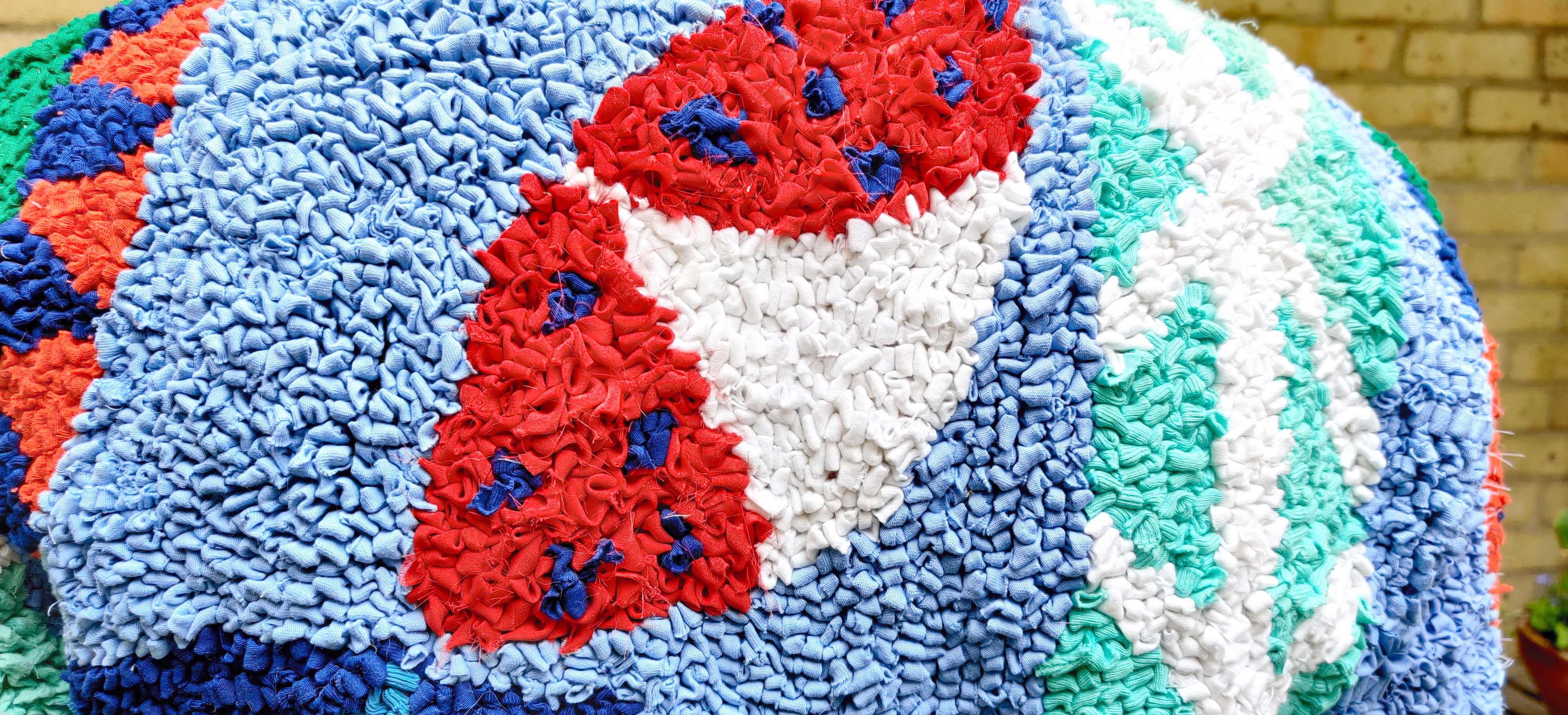 close up back shoulders design detail jacket rag rug