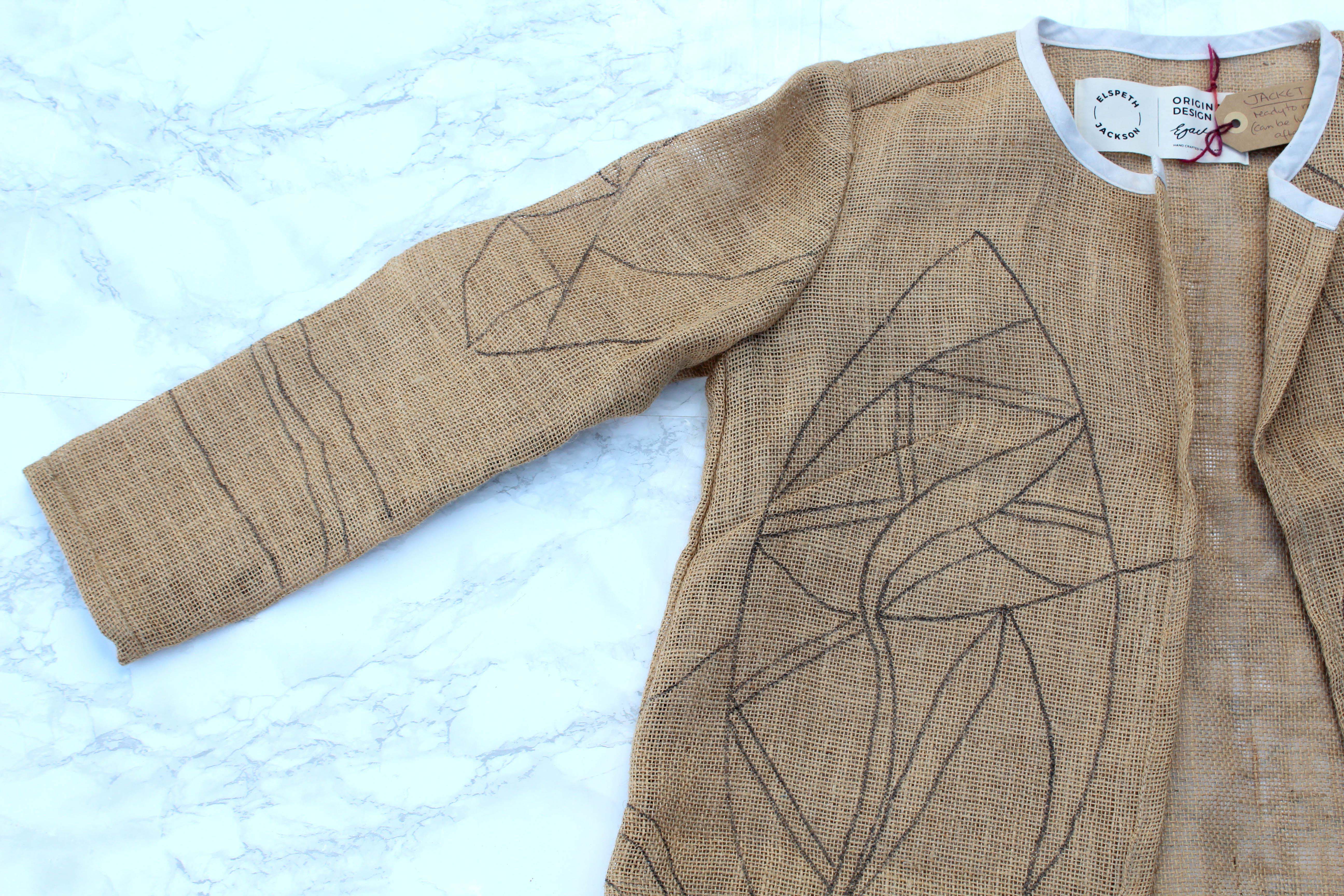 hessian sleeve for rag rug jacket on marble background