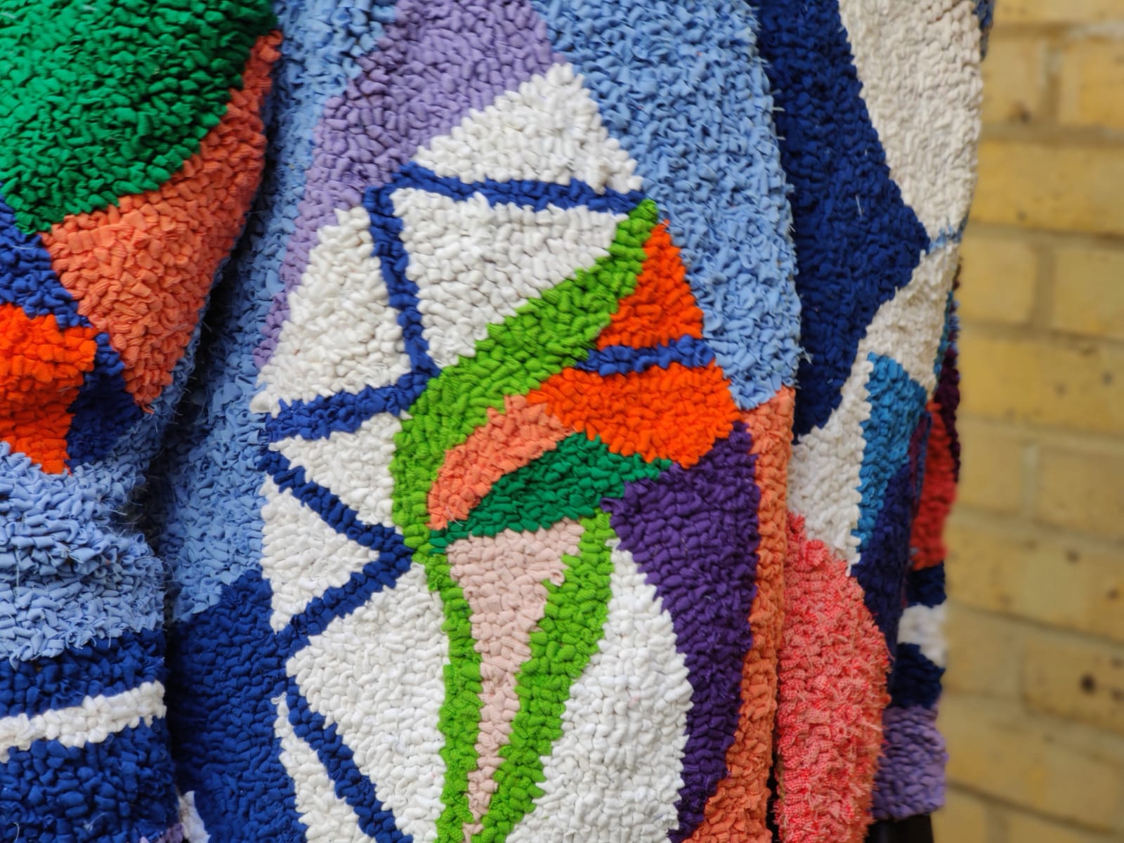 close up design rag rug jacket sleeve