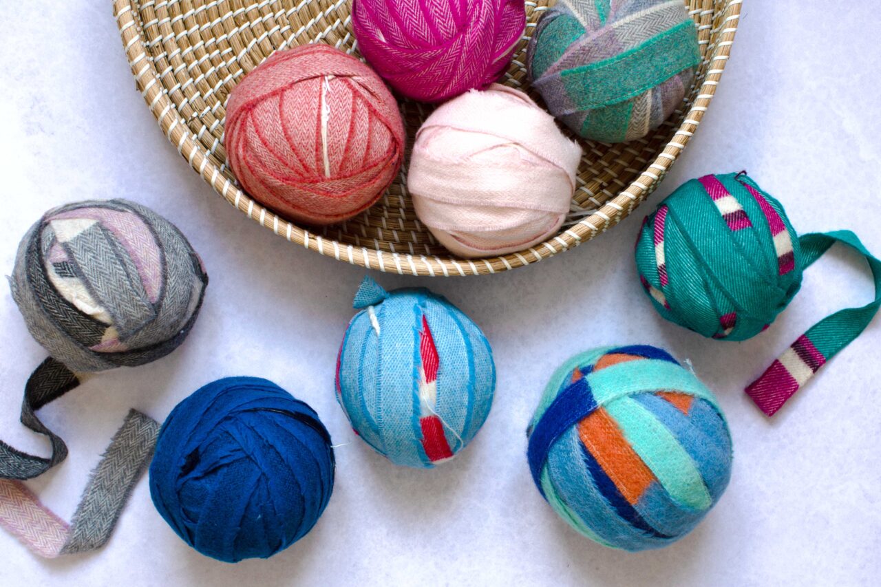 Balls of multicoloured blanket offcuts found in the Ragged Life Lucky Dip Pack