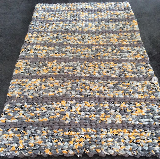 striped grey and yellow patterned fabric rag rug
