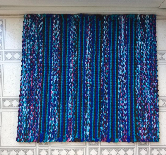 blue and purple patterned twined rag rug