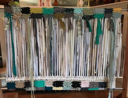 work in progress square patterned rag rug