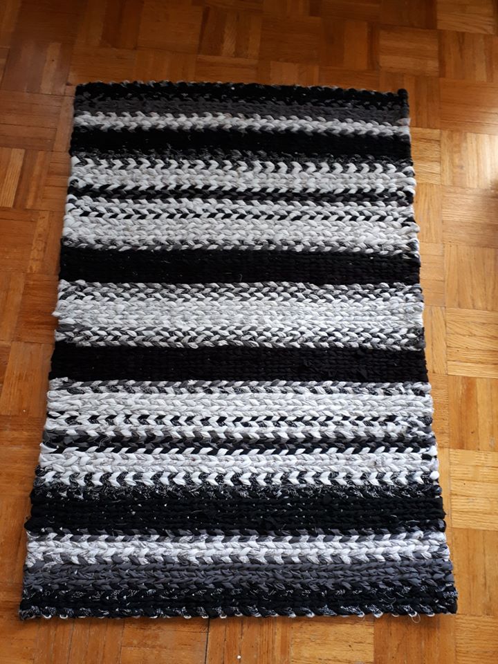 striped black and white twined rag rug