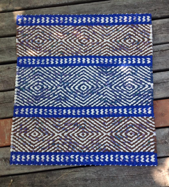 Patterned blue twined rag rug