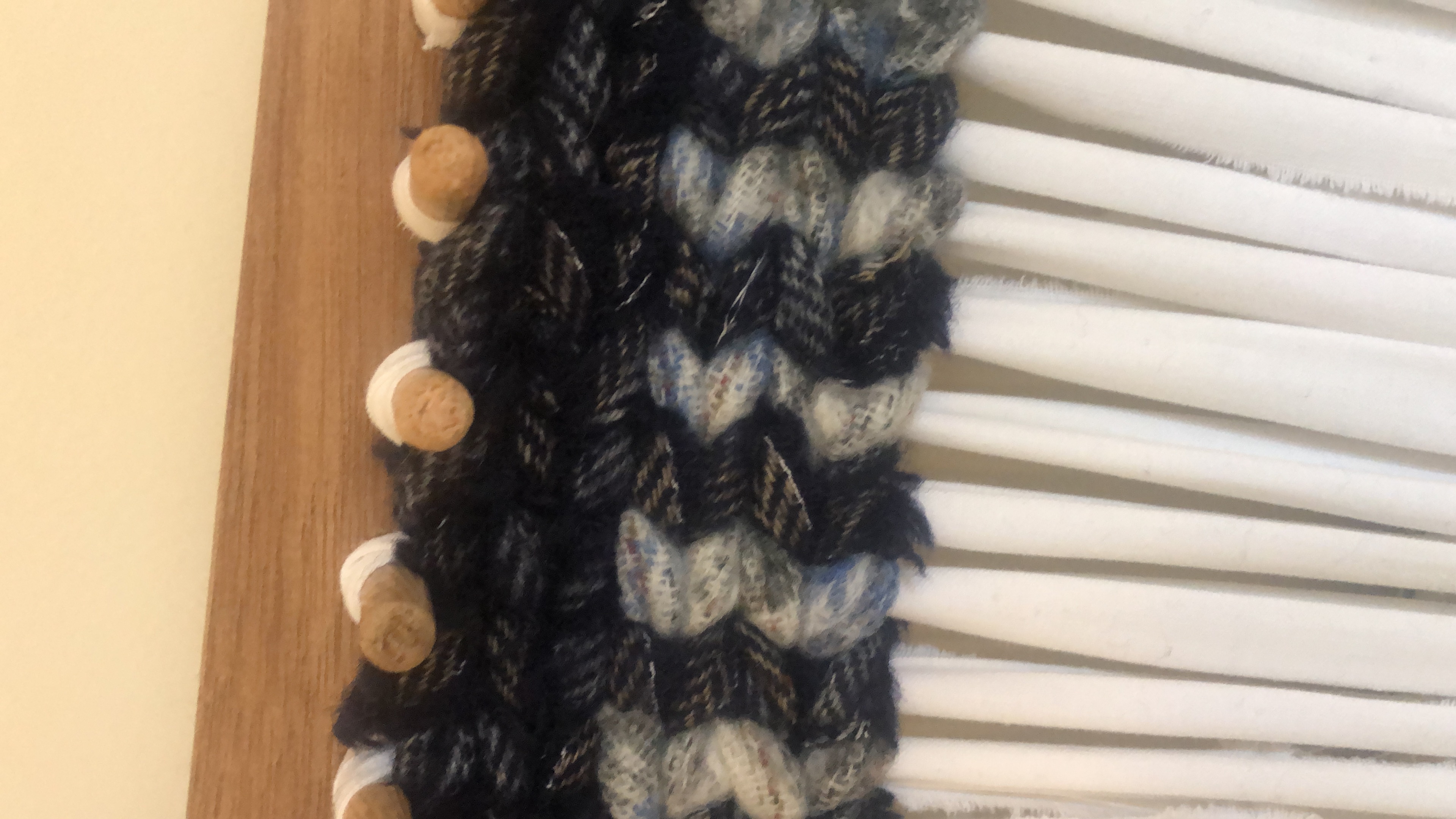 Wooden pegs on twining loom