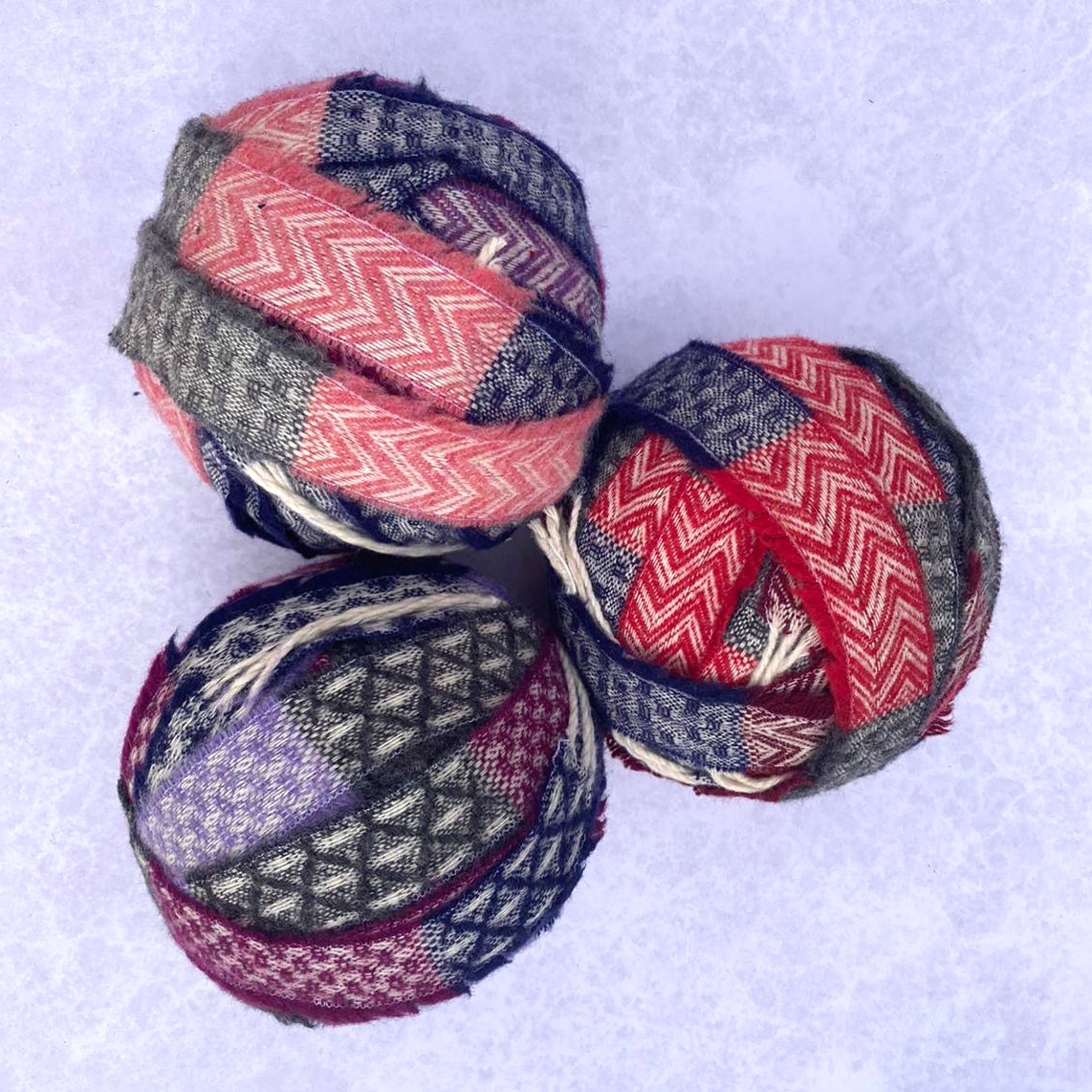 Pink, red and purple striped chenille yarn