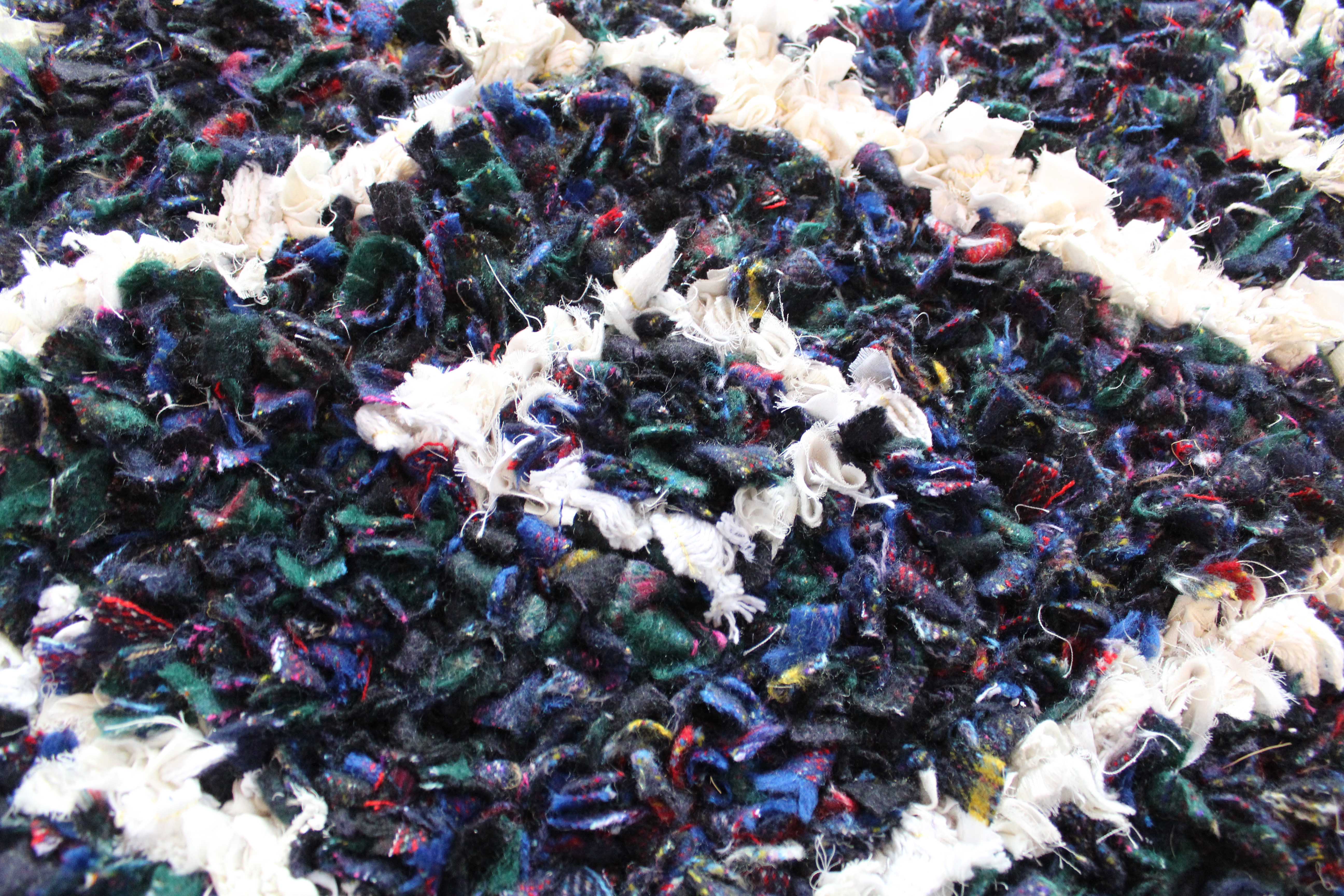 close up of tartan fabric used in shaggy rag rug