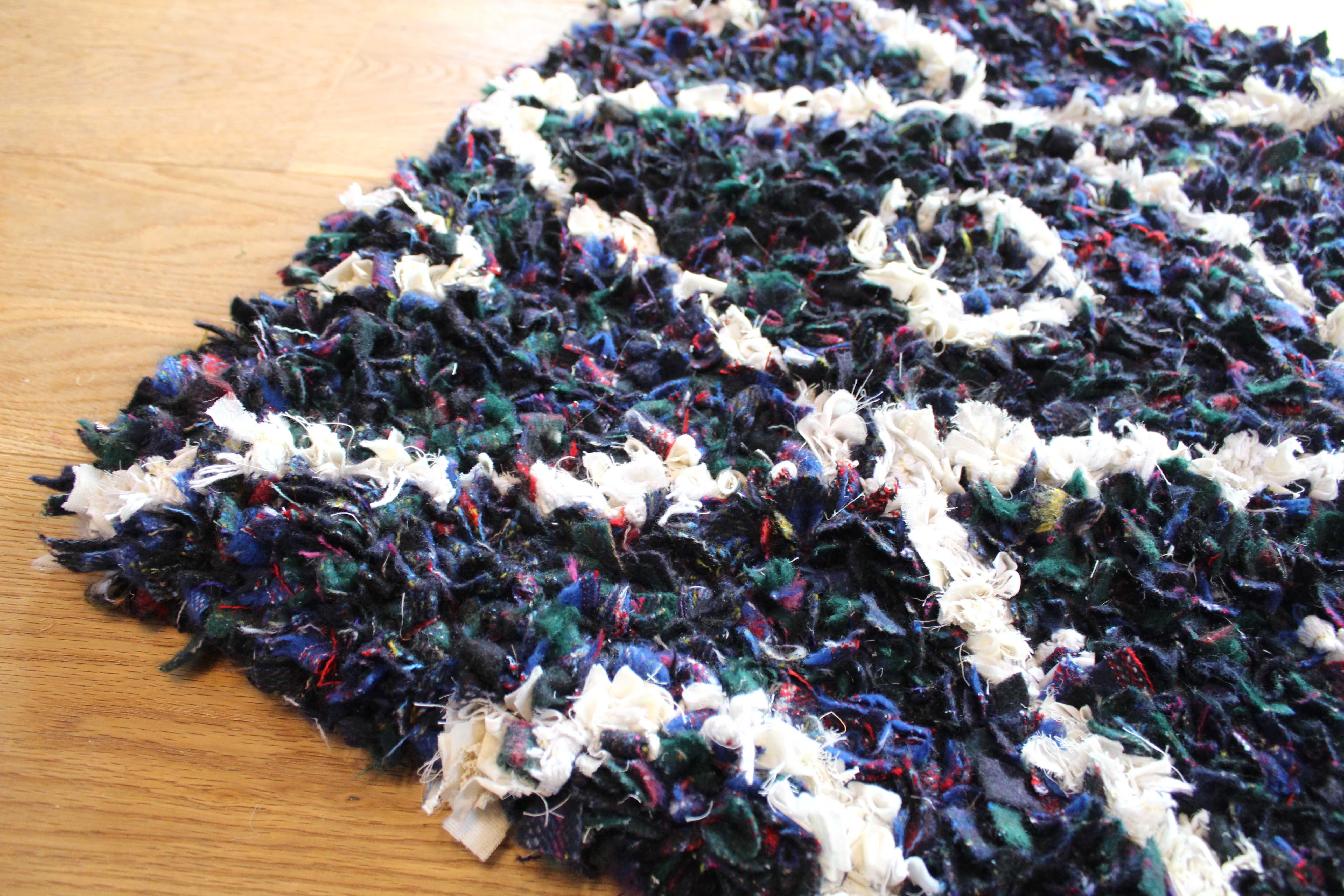 close up corner shaggy tartan blanket yarn rag rug