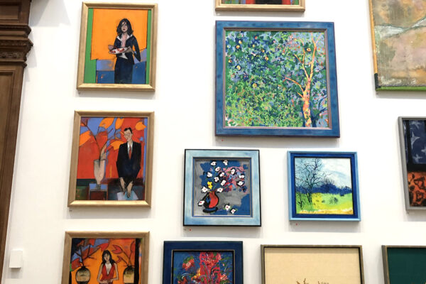 royal academy exhibition wall of colourful framed art work