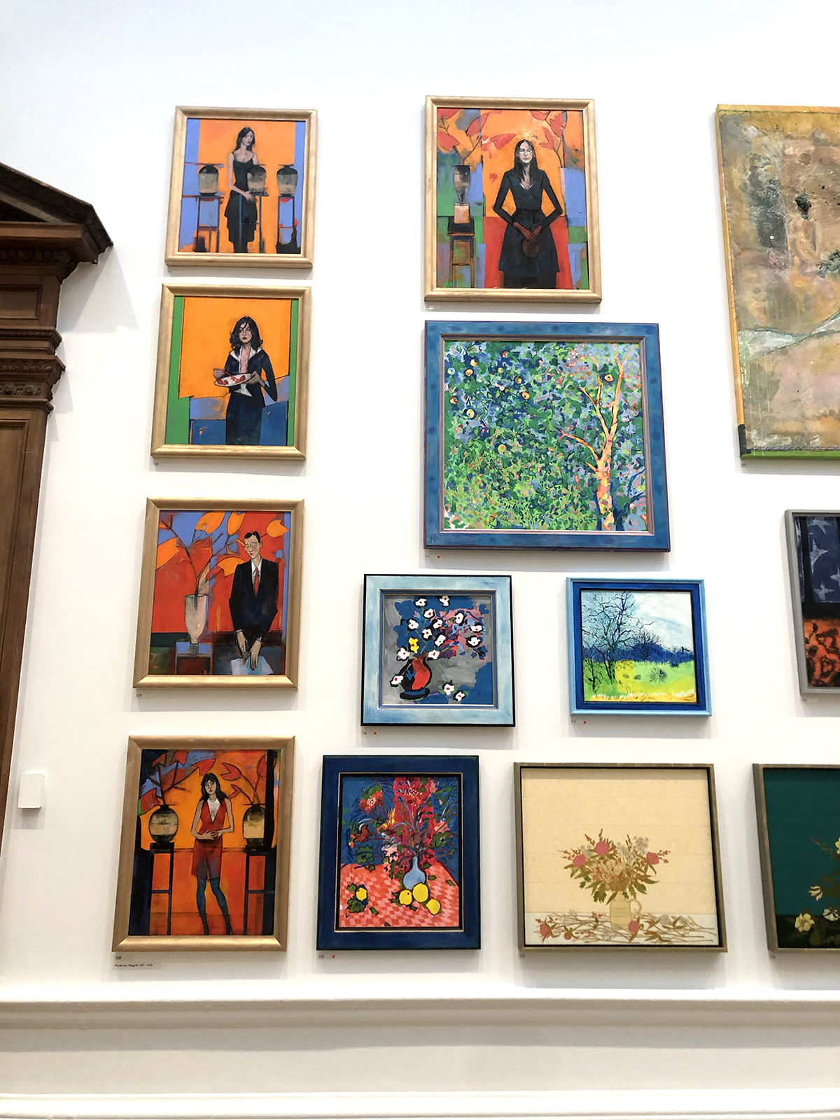 royal academy exhibition wall of colourful framed art work