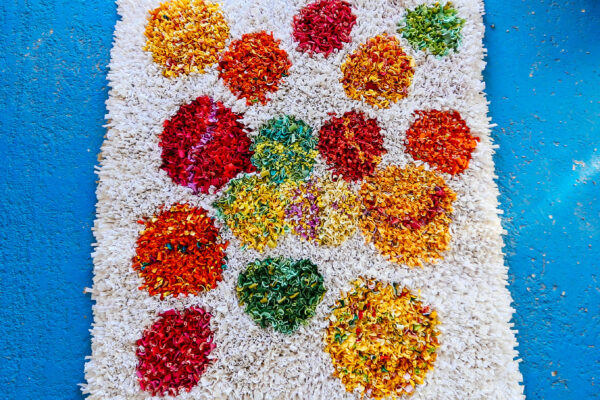 White colourful spotty rag rug in proddy shaggy style made from t-shirts