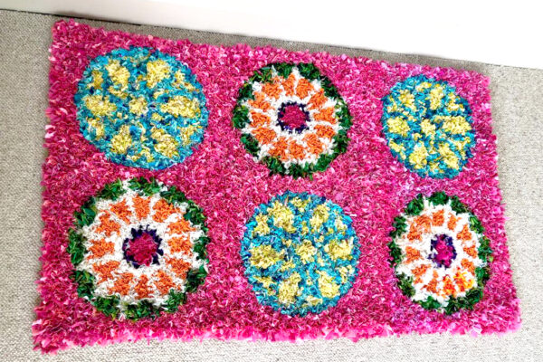 Matthew Williamson inspired rag rug with circles on a pink background