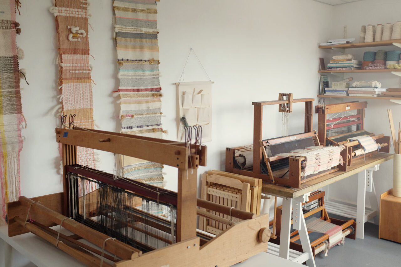 Lucy Rowan from Peasandneedles studio with table looms